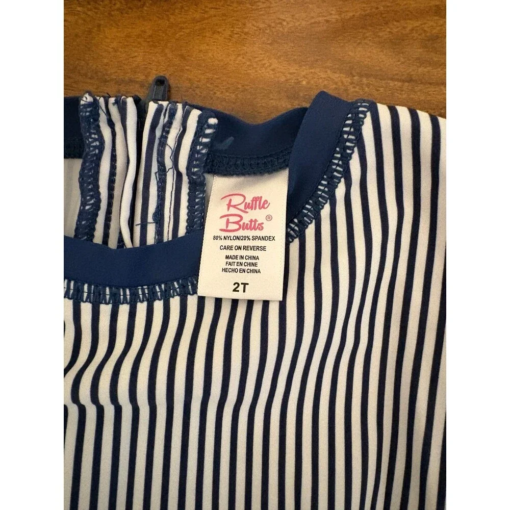 RuffleButts Long Sleeve Rash Guard Swimsuit, Navy/White, Size 2T